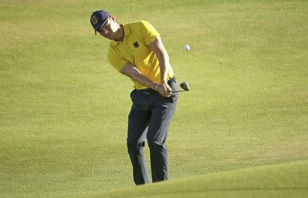 2016 Rio Olympics - Golf - Preliminary - Men's Individual Stroke Play - Olympic Golf Course - Rio de Janeiro, Brazil - 12/08/2016. Martin Kaymer (GER) of Germany chips on to the 18th green during the second round of the men's Olympic golf competition. REUTERS/Andrew Boyers/Files