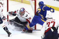 Buffalo Sabres right wing JJ Peterka (77) is stopped by Washington Capitals goaltender Charlie Lindgren (79) during the third period of an NHL hockey game Thursday, April 11, 2024, in Buffalo, N.Y. (AP Photo/Jeffrey T. Barnes)