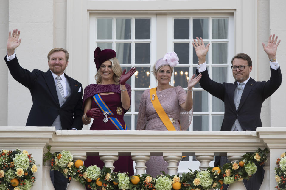 Dutch King Willem-Alexander, Queen Maxima, Princess Laurentien and Prince Constantijn, from left to right, wave from the balcony of royal palace Noordeinde in The Hague, Netherlands, Tuesday, Sept. 17, 2019, after a ceremony marking the opening of the parliamentary year with a speech by King Willem-Alexander outlining the government's budget plans for the year ahead. (AP Photo/Peter Dejong)