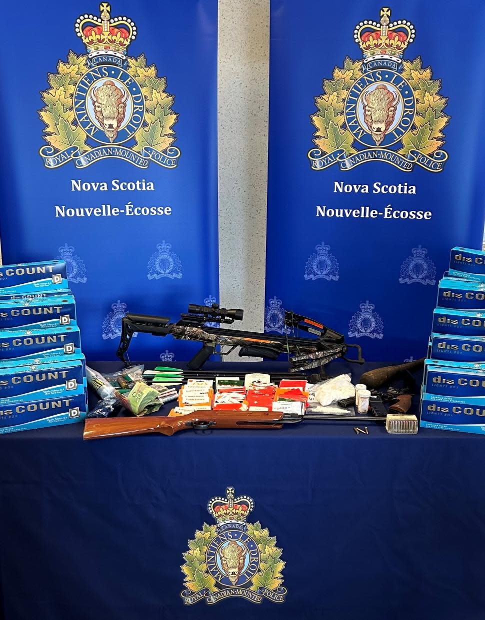 Police seized a camper and another vehicle from a man arrested for allegedly selling drugs near an encampment in Lower Sackville N.S.  A spokesperson for the RCMP said cocaine, pills believed to be opioids, a crossbow, stun gun and a number of replica firearms were also seized.  (RCMP - image credit)