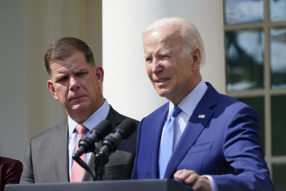 President Joe Biden, with Secretary of Labor Marty Walsh, left, speaks about a tentative railway labor agreement in the Rose Garden of the White House, Thursday, Sept. 15, 2022, in Washington. (AP Photo/Susan Walsh)