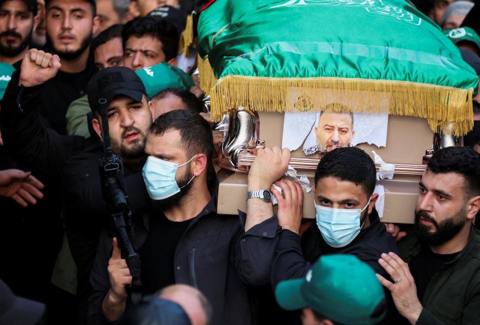 Mourners gather during the funeral of deputy head of Hamas, Saleh al-Arouri, who was killed by what Lebanese and Palestinian security sources say was a drone strike by Israel in Beirut on Jan. 4, 2024. Israel has neither confirmed nor denied that it killed Arouri in the attack. 