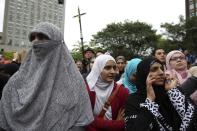 Women in traditional garb gather to protest against Quebec's proposed Charter of Values in Montreal, September 14, 2013. Thousands took to the streets to denounce the province's proposed bill to ban the wearing of any overt religious garb by government paid employees. REUTERS/Christinne Muschi (CANADA - Tags: CIVIL UNREST POLITICS RELIGION)