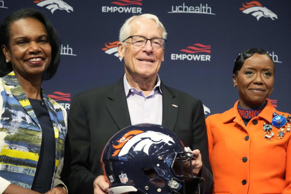 Rob Walton, center, is flanked by Condoleezza Rice, left, and Mellody Hobson during a news conference at the Denver Broncos’ headquarters Wednesday, Aug. 10, 2022, in Centennial, Colo. (AP Photo/David Zalubowski)