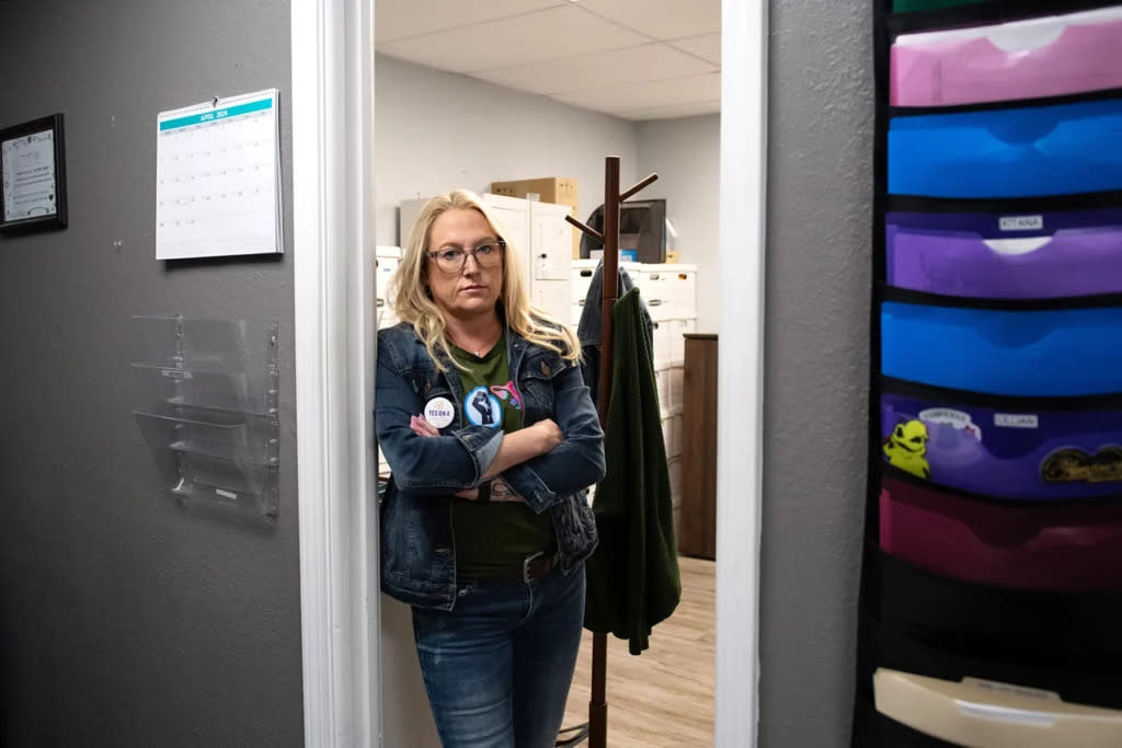 Kelly Flynn, president of A Woman’s Choice in Jacksonville, Florida, stands in the doorway of her office.