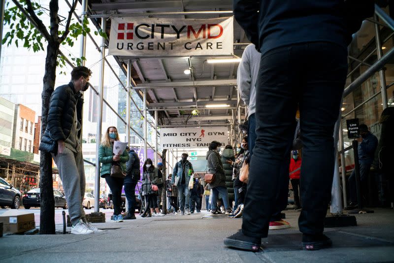 People wait in line outside of a coronavirus disease (COVID-19) testing center in New York City, New York