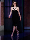 <p>Emmy Rossum makes an entrance at <em>Late Night with Seth Meyers </em>in N.Y.C. on May 19.</p>