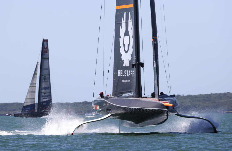 Ineos Team UK, right, leads American Magic during the Prada Cup challengers series on Auckland's Waitemate Harbour, New Zealand, Friday, Jan. 15, 2021. The winner of the five week long Challenger Series goes on to challenge defenders Team New Zealand for the America's Cup from March 6 to 15. (Brett Phibbs/NZ Herald via AP)