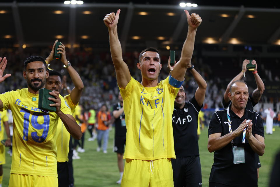 RIYADH, SAUDI ARABIA - AUGUST 12: Cristiano Ronaldo of Al Nassr celebrates with teammates after the team's victory in the Arab Club Champions Cup Final between Al Hilal and Al Nassr at King Fahd International Stadium in Riyadh, Saudi Arabia on August 12, 2023. (Photo by Stringer/Anadolu Agency via Getty Images)