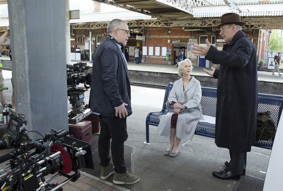 Bill Condon gives direction to Helen Mirren and Ian McKellen while on location for The Good Liar. (Warner Bros.)