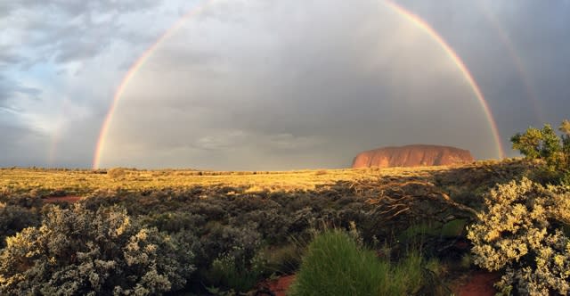 Stunning rainbow pictured over Australia's famous Uluru landmark