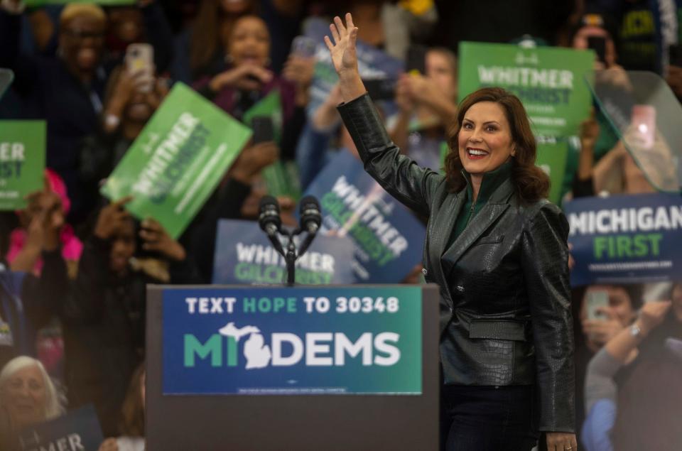 Michigan Governor Gretchen Whitmer gets greeted with applause and cheers during a rally inside a gymnasium at Renaissance High School in Detroit on Saturday, Oct. 29, 2022.