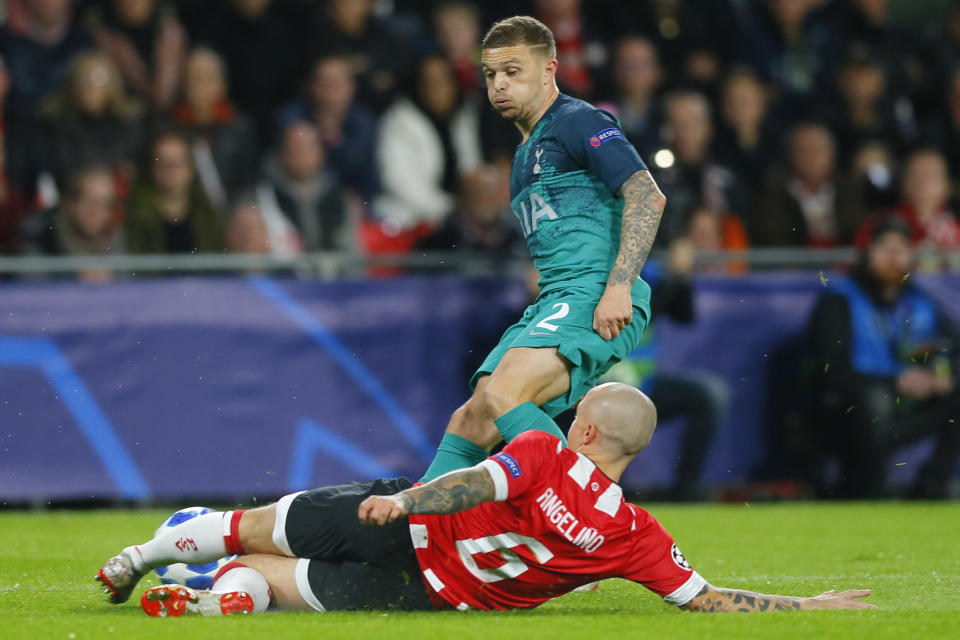 PSV's Jose Tasende, sliding, and Tottenham defender Kieran Trippier vie for the ball during a Group B Champions League soccer match between PSV Eindhoven and Tottenham Hotspur at the Philips stadium in Eindhoven, Netherlands, Wednesday, Oct. 24, 2018. (AP Photo/Peter Dejong)
