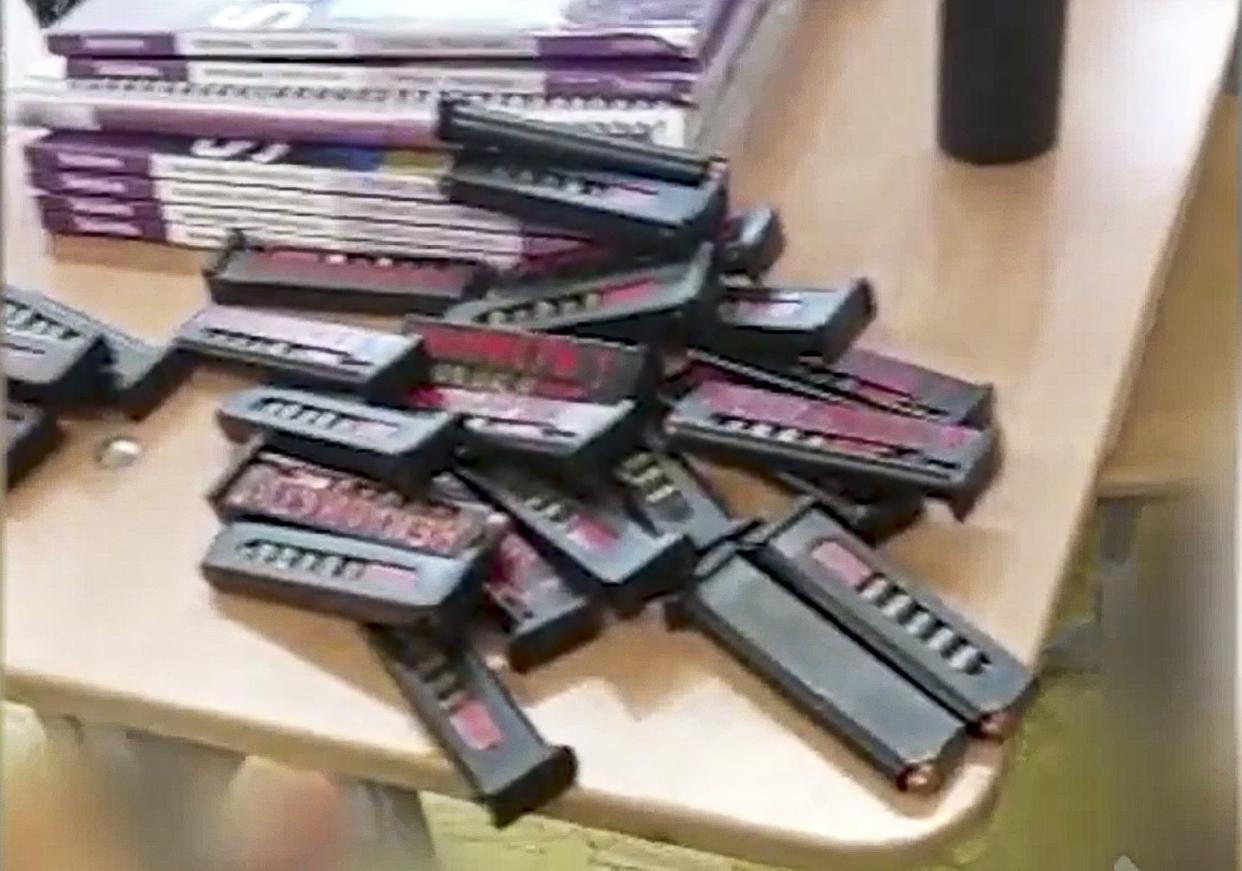 In this handout image taken from video released by the Russian Investigative Committee, ammunition is seen on a table at the scene of a shooting at school No. 88 in Izhevsk, Russia, Monday, Sept. 26, 2022. 