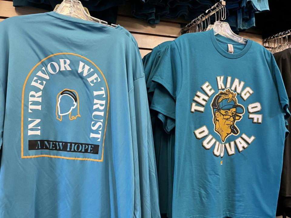 Sports Mania in Jacksonville Beach has a wide selection of Jaguar shirts, many of them featuring quarterback Trevor Lawrence (left) and coach Doug Pederson (right).