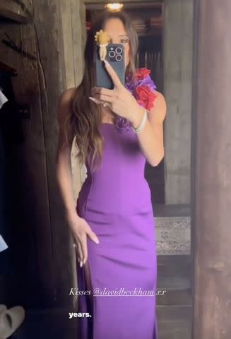 <p>Victoria Beckham/instagram</p> Victoria Beckham poses in her purple 1999 wedding outfit.