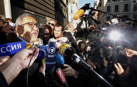 Yves Haddad (L), lawyer of Jean-Claude Mas, founder of French company Poly Implant Prothese (PIP), speaks to journalists outside the Marseille's court December 10, 2013. The founder of a French breast implant company was sentenced to four years in prison by a Marseille criminal court on Tuesday for hiding the true nature of the sub-standard silicone used in implants sold to 300,000 women around the world. REUTERS/Jean-Paul Pelissier