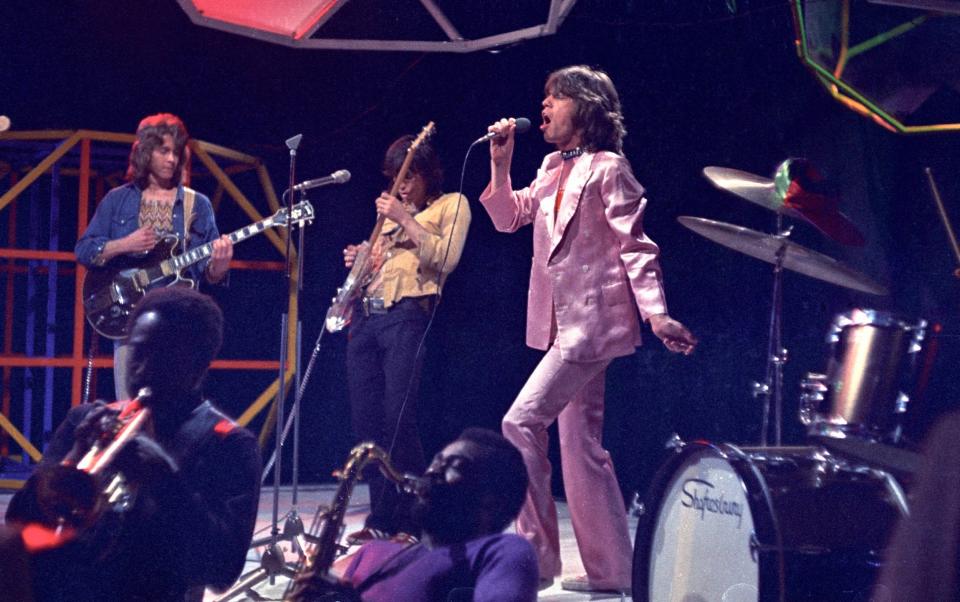 Mick Taylor, Keith Richards, Mick Jagger - performing on Top Of The Pops TV Show - Ron Howard/Redferns