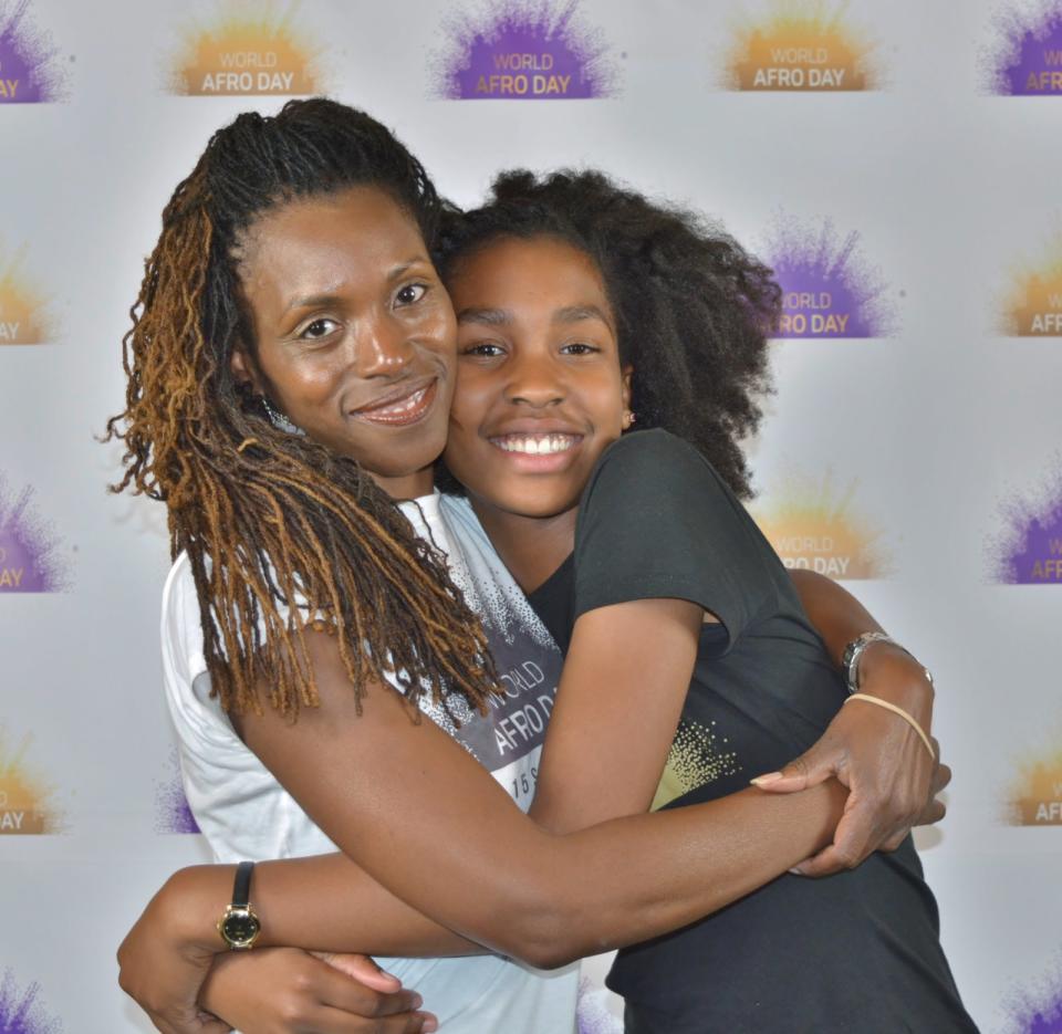 Michelle De Leon with her daughter Estelle at the first World Afro Day in 2017 (RB Incite Photography)