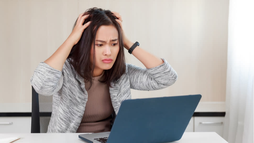  Woman annoyed at laptop crash. 