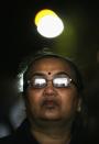 LEICESTER, UNITED KINGDOM - NOVEMBER 13: A woman watches the entertainment on stage during the Hindu festival of Diwali on November 13, 2012 in Leicester, United Kingdom. Up to 35,000 people attended the Diwali festival of light in Leicester's Golden Mile in the heart of the city's asian community. The festival is an opportunity for Hindus to honour Lakshmi, the goddess of wealth and other gods. Leicester's celebrations are one of the biggest in the world outside India. Sikhs and Jains also celebrate Diwali. (Photo by Christopher Furlong/Getty Images)