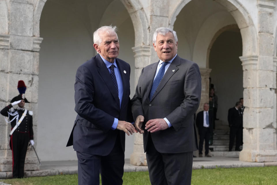 Italian Foreign Minister Antonio Tajani, right, welcomes European Union foreign policy chief Josep Borrell at the G7 Foreign Ministers meeting, on the Island of Capri, Italy, Wednesday, April 17, 2024. Group of Seven foreign ministers are meeting on the Italian resort island of Capri, with soaring tensions in the Mideast and Russia's continuing war in Ukraine topping the agenda. The meeting runs April 17-19. (AP Photo/Gregorio Borgia)