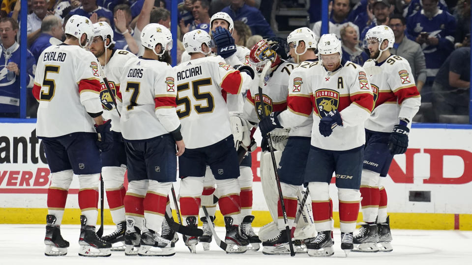 Florida Panthers players consol goaltender Sergei Bobrovsky (72) after the Tampa Bay Lightning eliminated the Panthers during Game 4 of an NHL hockey second-round playoff series Monday, May 23, 2022, in Tampa, Fla. (AP Photo/Chris O'Meara)