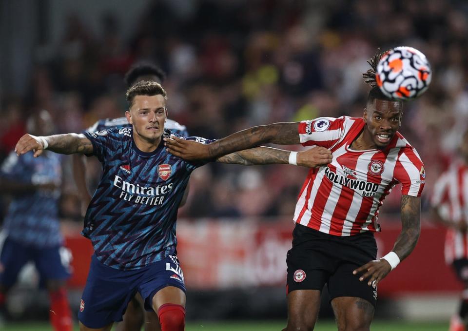 Ben White with Ivan Toney in Arsenal’s opening-night defeat by Brentford (Getty Images)