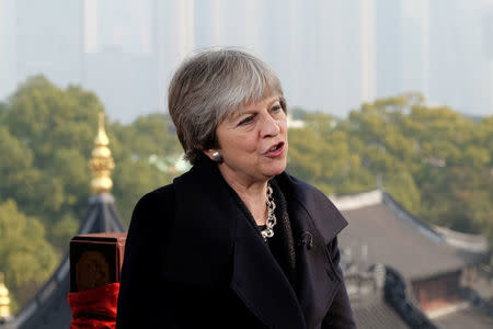 British Prime Minister Theresa May speaks to members of the media in Shanghai, China February 2, 2018. REUTERS/William James