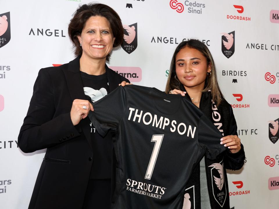 Alyssa Thompson poses with Angel City FC co-founder Julie Uhrman after she was selected with the first overall pick in the 2023 NWSL Draft.