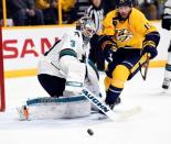 San Jose Sharks goalie Martin Jones (31) watches after a rebound with pressure from Nashville Predators right winger Craig Smith (15) during the third period in game three of the second round of the 2016 Stanley Cup Playoffs at Bridgestone Arena. Mandatory Credit: Christopher Hanewinckel-USA TODAY Sports