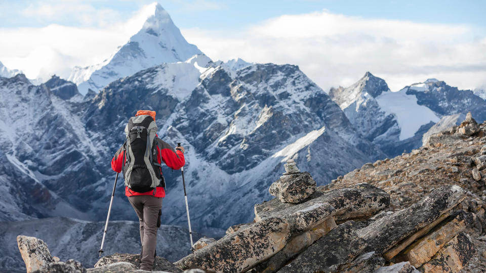 Hiker walks on train in Himalayas - Stock imageMt. Everest, Hiking, Himalayas, Mountain, Nepal
