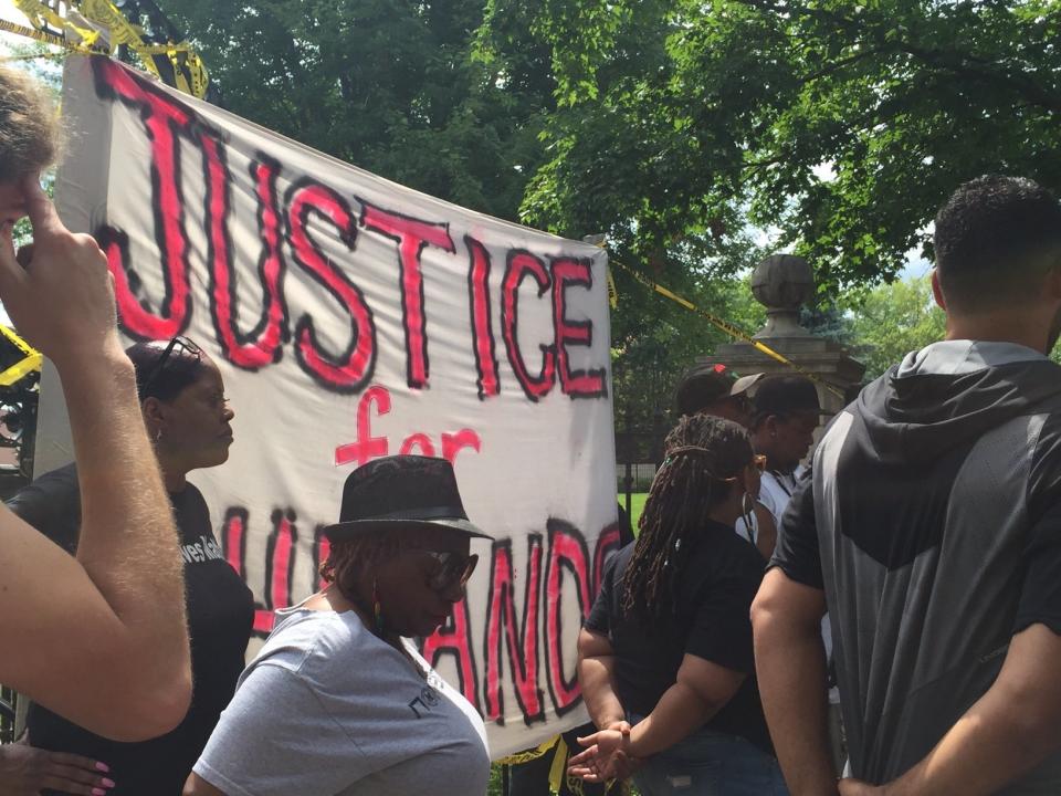 People protest outside the Minnesota Governor's Residence in St. Paul Minnesota on July 7, 2016.