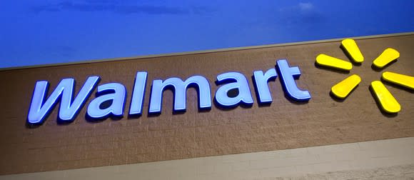 A Wal-Mart sign on a storefront.