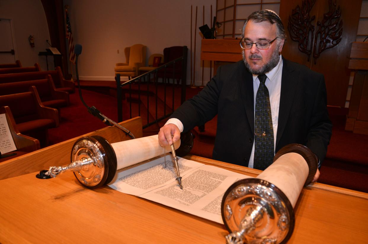 Rabbi Craig Mayers with Temple Beth Sholom in Melbourne, reads from the Torah during Shavuot, the celebration of the original giving of the Torah on Mount Sinai.