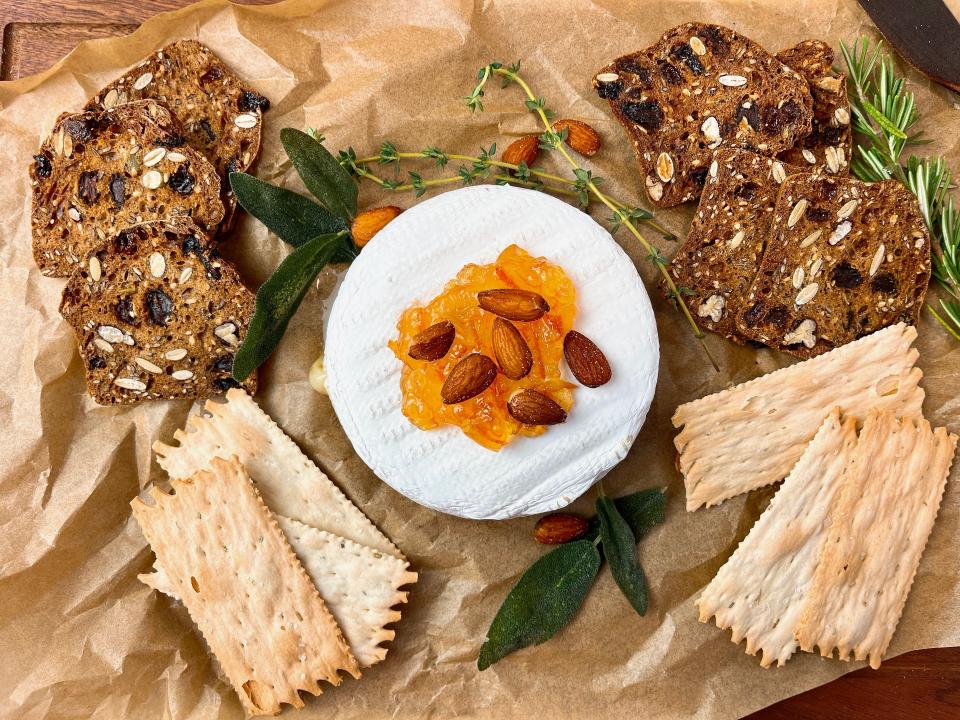 Serve baked brie with sturdy crackers for scooping.
