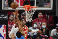 Atlanta Hawks' John Collins (20) blocks a shot by Milwaukee Bucks' Giannis Antetokounmpo during the first half of Game 3 of the NBA Eastern Conference basketball finals Sunday, June 27, 2021, in Atlanta. (AP Photo/Brynn Anderson)