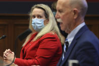 Loren Sweatt, Principal Deputy Assistant Secretary of Labor for Occupational Safety and Health, left, and John Howard, Director of the National Institute for Occupational Safety and Health, testify before a House Committee on Education and Labor Subcommittee on Workforce Protections hearing examining the federal government's actions to protect workers from COVID-19, Thursday, May 28, 2020 on Capitol Hill in Washington. (Chip Somodevilla/Pool via AP)