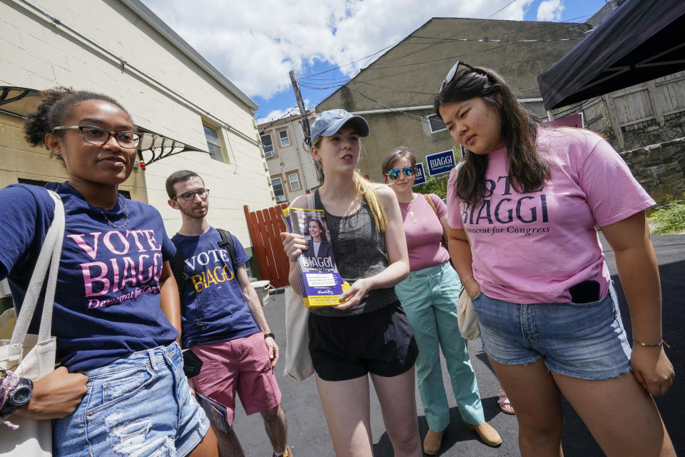 Fellows with New York 17th Congressional District Democratic primary candidate state Sen. Alessandra Biaggi talk about the Biaggi during a canvass launch event for her campaign, Saturday, Aug. 13, 2022, in Sleepy Hollow, N.Y. (AP Photo/Mary Altaffer)