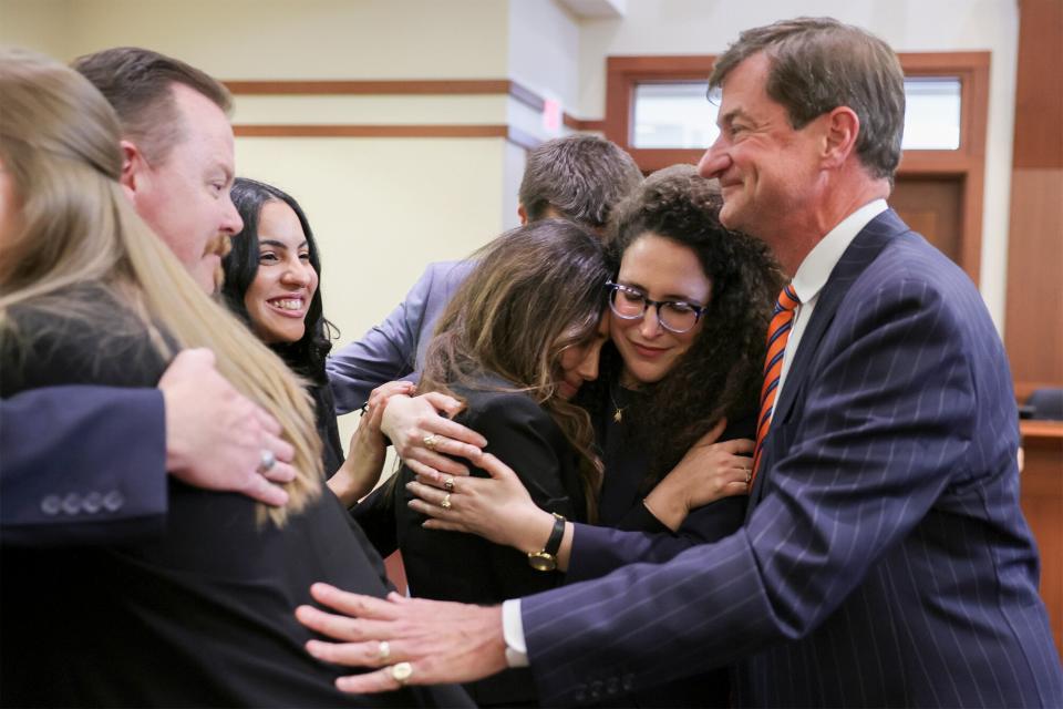 Johnny Depp's attorneys including Camille Vasquez and Benjamin Chew celebrate after the jury's verdict in the Depp v. Heard civil defamation trial at the Fairfax County Circuit Courthouse in Fairfax, Virginia