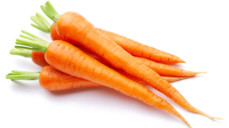 Orange carrots on white background