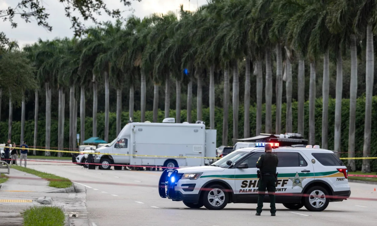 <span>Officers guard the rear entrance of the Trump International golf club in West Balm Beach, Florida, on Sunday.</span><span>Photograph: Cristóbal Herrera/EPA</span>