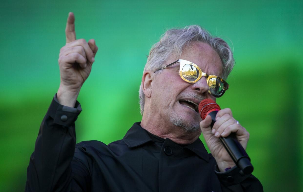 Devo's Mark Mothersbaugh sings onstage