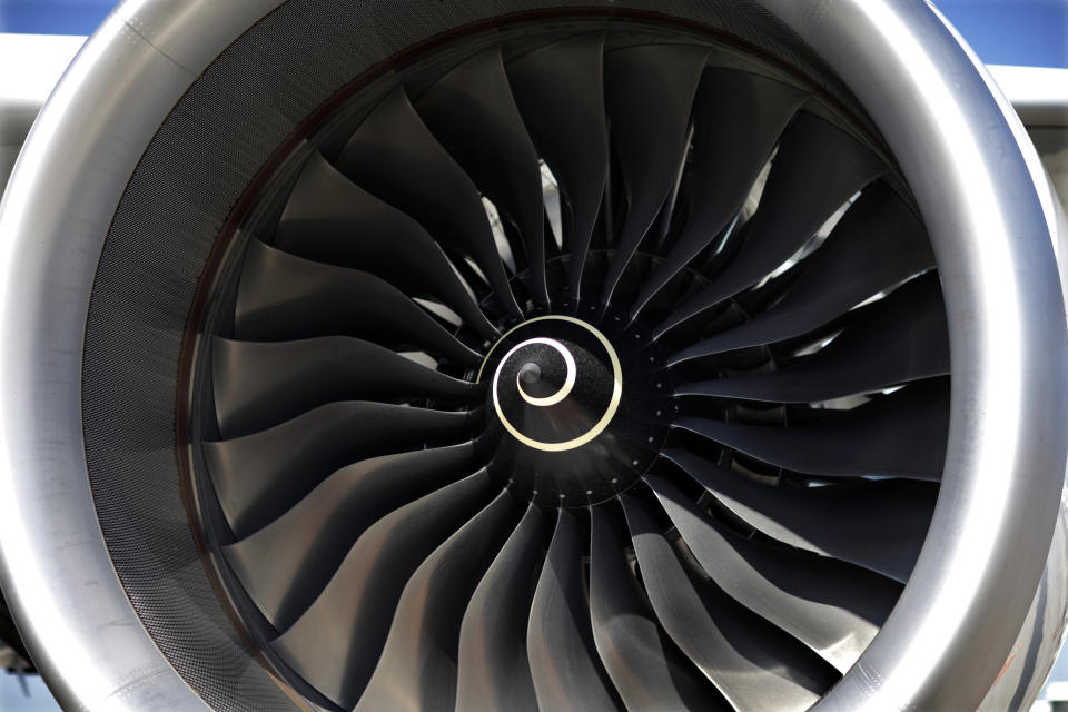 FILE- This July 16, 2015, file photo shows the blades of a Rolls-Royce engine on an Airbus A350 XWB test flight aircraft, parked at Newark Liberty international airport in Newark, N.J.  British plane engine manufacturer Rolls-Royce said Thursday, June 14, 2018, that it plans to cut 4,600 jobs over the next 2 years as part of a major restructuring effort. (AP Photo/Mel Evans, File)