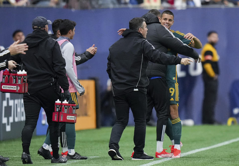 LA Galaxy's Dejan Joveljic (9) celebrates his goal against the Vancouver Whitecaps during the second half of an MLS soccer match Saturday, April 13, 2024, in Vancouver, British Columbia. (Darryl Dyck/The Canadian Press via AP)