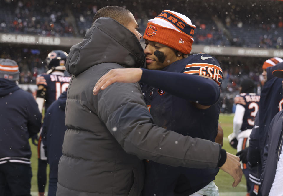 Chicago Bears quarterback Justin Fields hugs general manager Ryan Poles as they celebrate a win over the Atlanta Falcons on Dec. 31, 2023, at Soldier Field in Chicago. (Brian Cassella/Chicago Tribune/Tribune News Service via Getty Images)