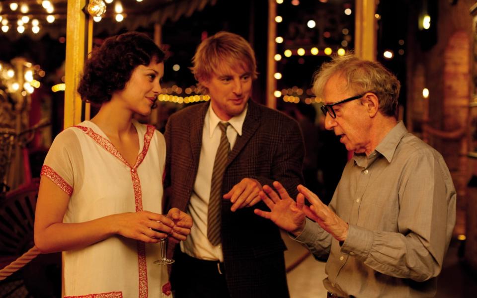 Marion Cotillard and Owen Wilson with Woody Allen on the set of Midnight in Paris