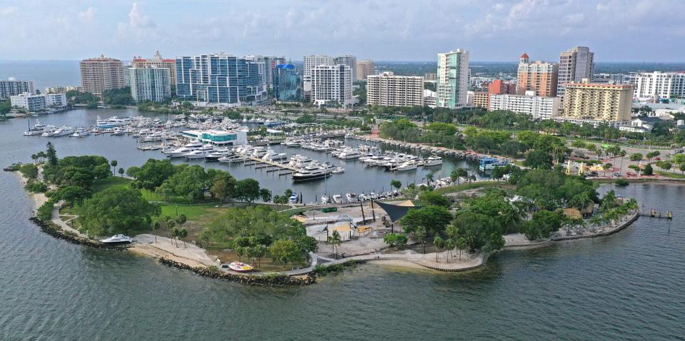 The day after Hurricane Idalia passed by Sarasota's coastline in the Gulf of Mexico left two boats high and dry at Bayfront Park. Here an aerial view of Bayfront Park along with Marina Jack on Thursday, Aug. 31, 2023.