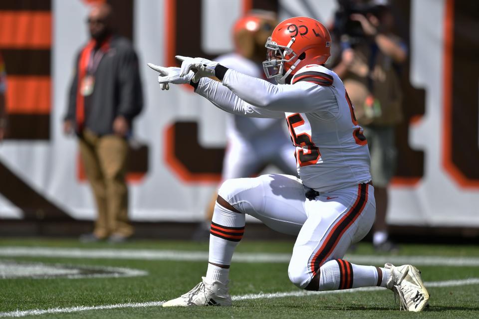 Cleveland Browns defensive end Myles Garrett celebrates a sack during the first half of an NFL football game against the Chicago Bears, Sunday, Sept. 26, 2021, in Cleveland. (AP Photo/David Richard)