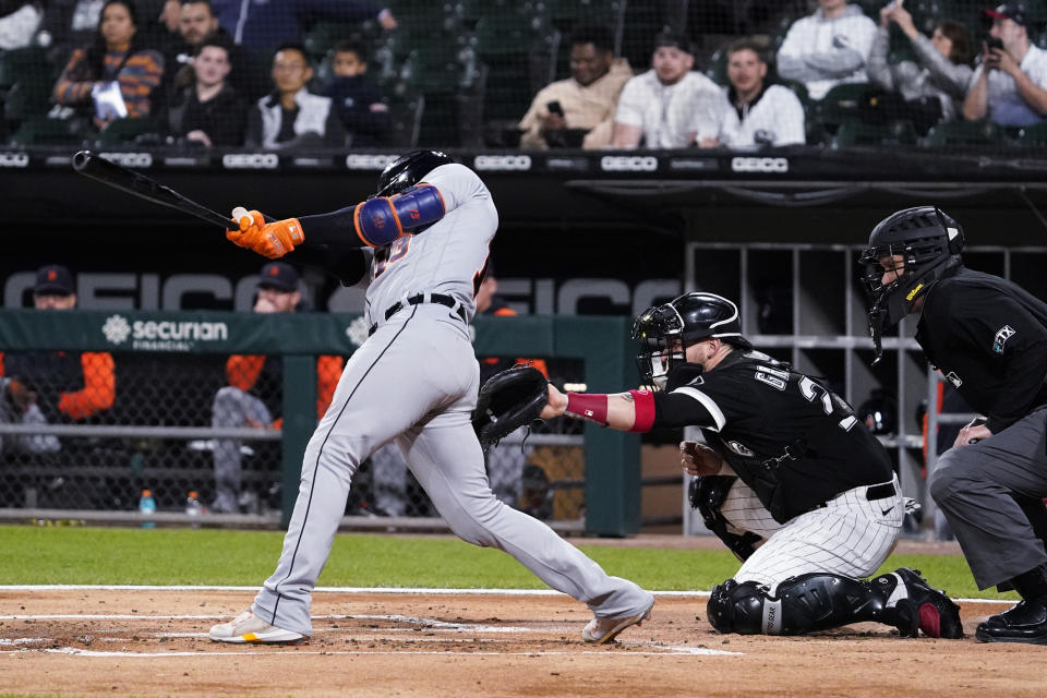 Detroit Tigers' Eric Haase hits an RBI single against the Chicago White Sox during the first inning of a baseball game in Chicago, Friday, Sept. 23, 2022. (AP Photo/Nam Y. Huh)